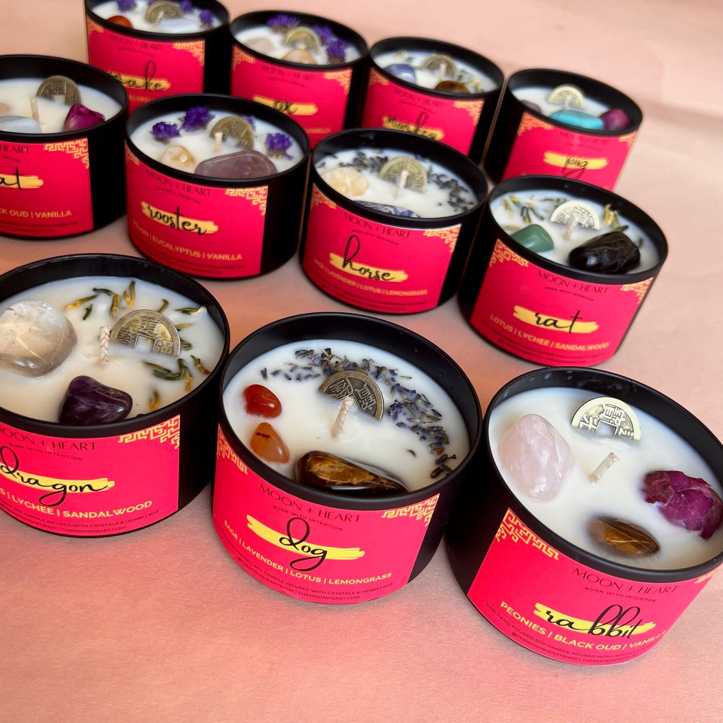 chinese zodiac snake candle infused with feng shui coin, carnelian and moonstone. Scented melon eucalyptus and vanilla.